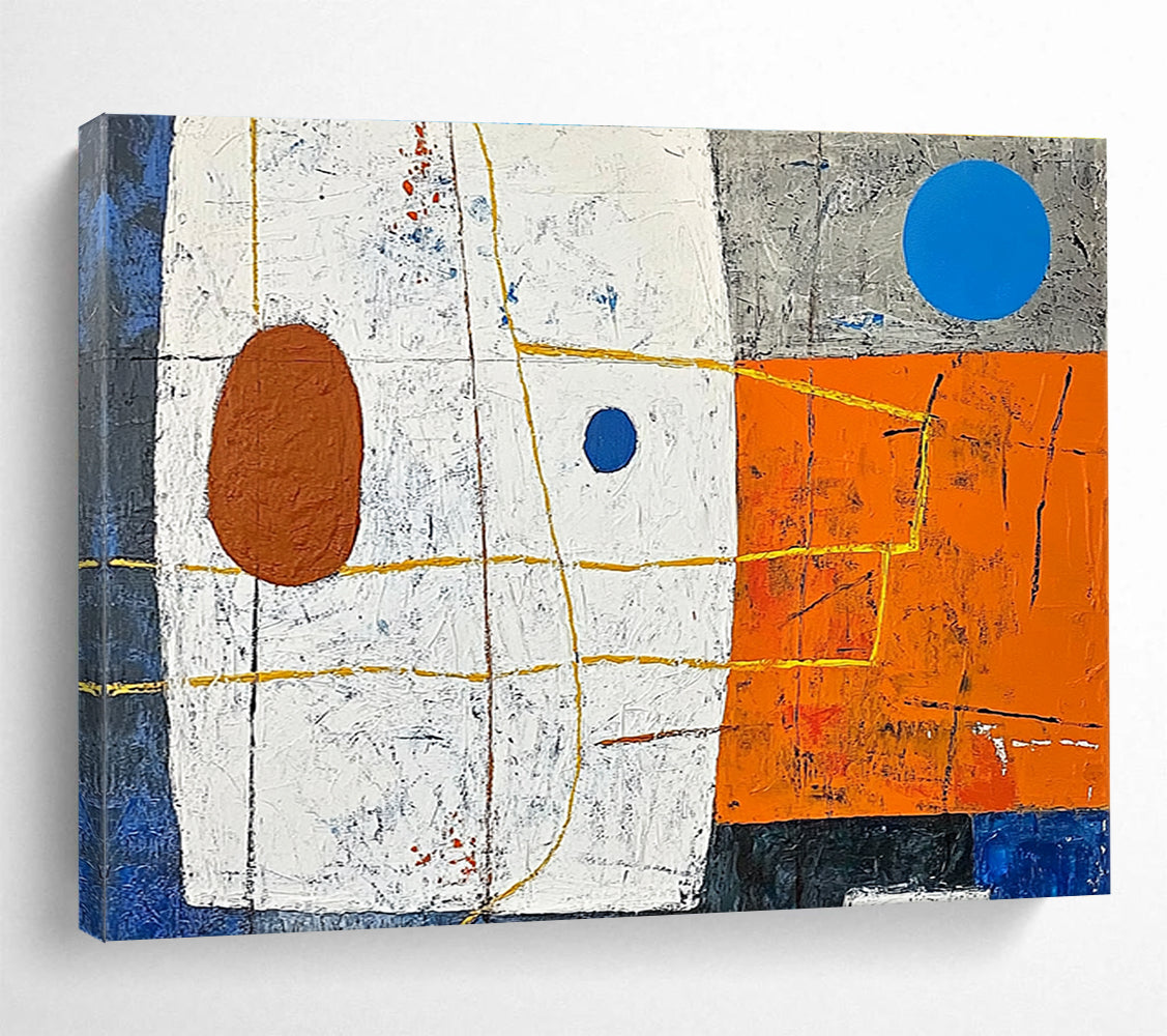 A large abstract painting featuring white squares orange and blue shapes yellow lines a small brown oval and a blue dot on a vibrant orange and dark grey background.SC376