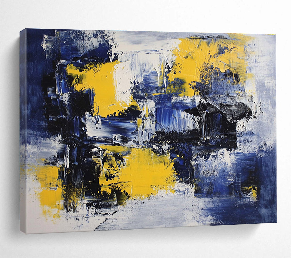Large abstract painting featuring deep blue, white, and yellow accents with impressionist brush strokes on canvas ideal for modern wall decor.SC031