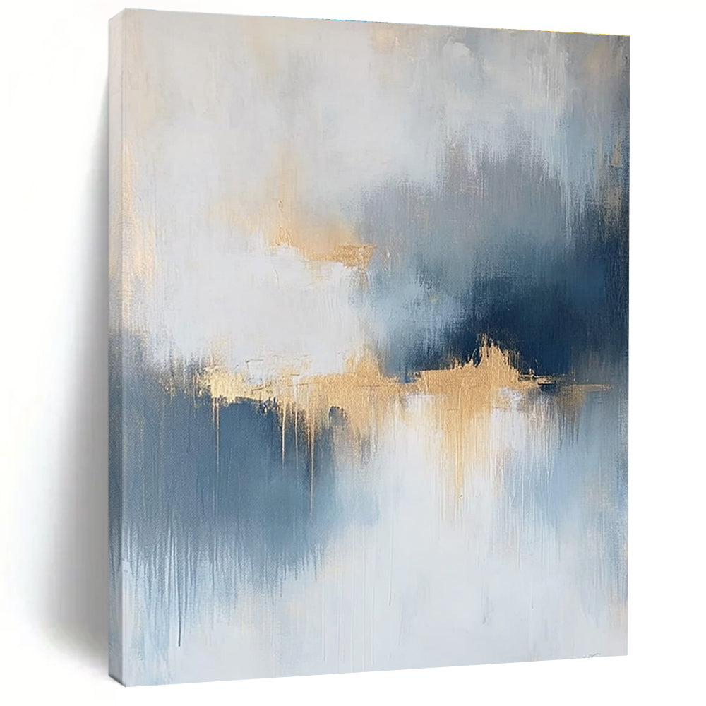 Large abstract painting featuring atmospheric clouds in soft blue gray and white tones with gold and silver accents and delicate textures.STSC386