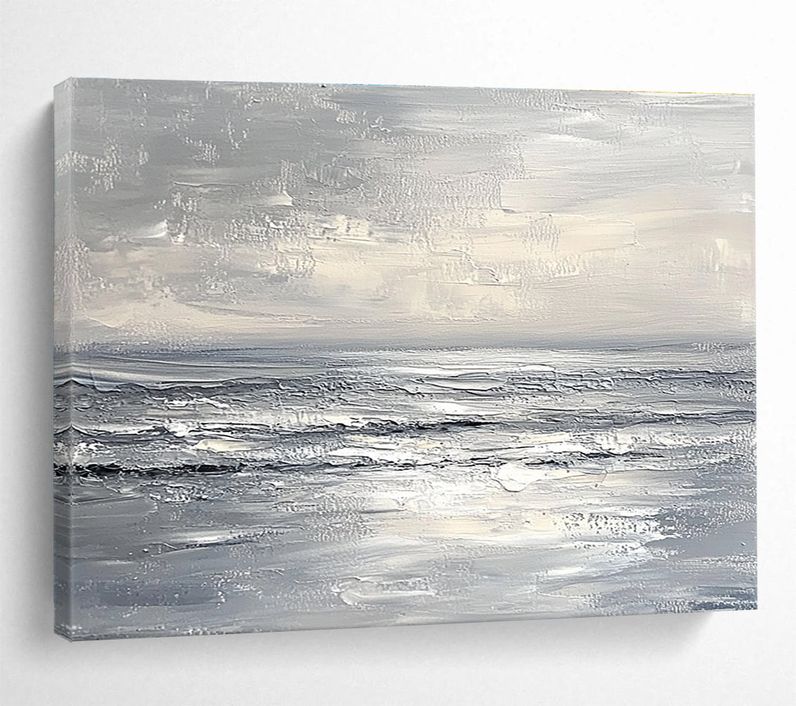 Abstract seascape in impasto oil, featuring textured strokes in muted whites and greys, capturing a minimalist beach with soft waves and sky.SC276