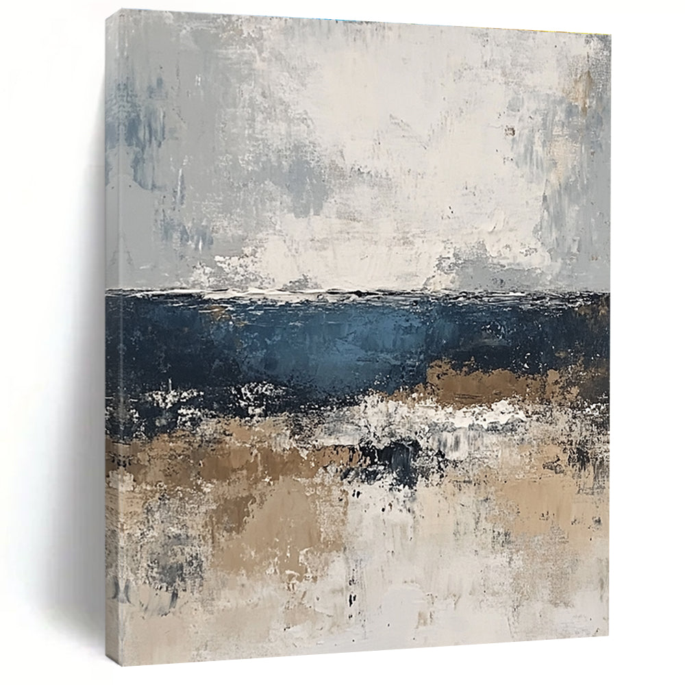 Large abstract painting of the sea in gray and blue tones with accents of beige brown and white for a serene artistic touch.STSC343