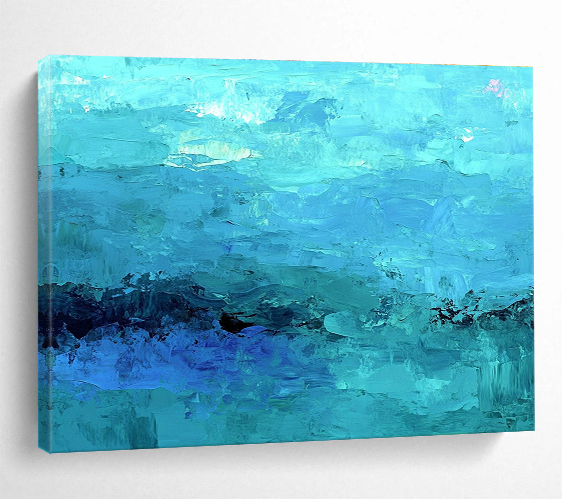 Large abstract painting of the ocean in soft blues and teals showcasing impressionistic waves and a mysterious silhouette beneath gentle mist.SC201