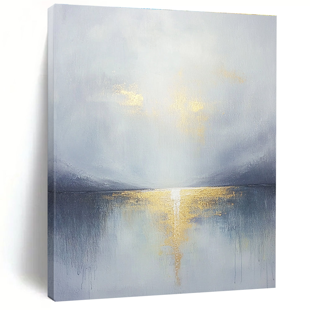 Large abstract painting featuring a grey sky clouds gold horizon and a tranquil lake in the foreground with soft muted colors.STSC289