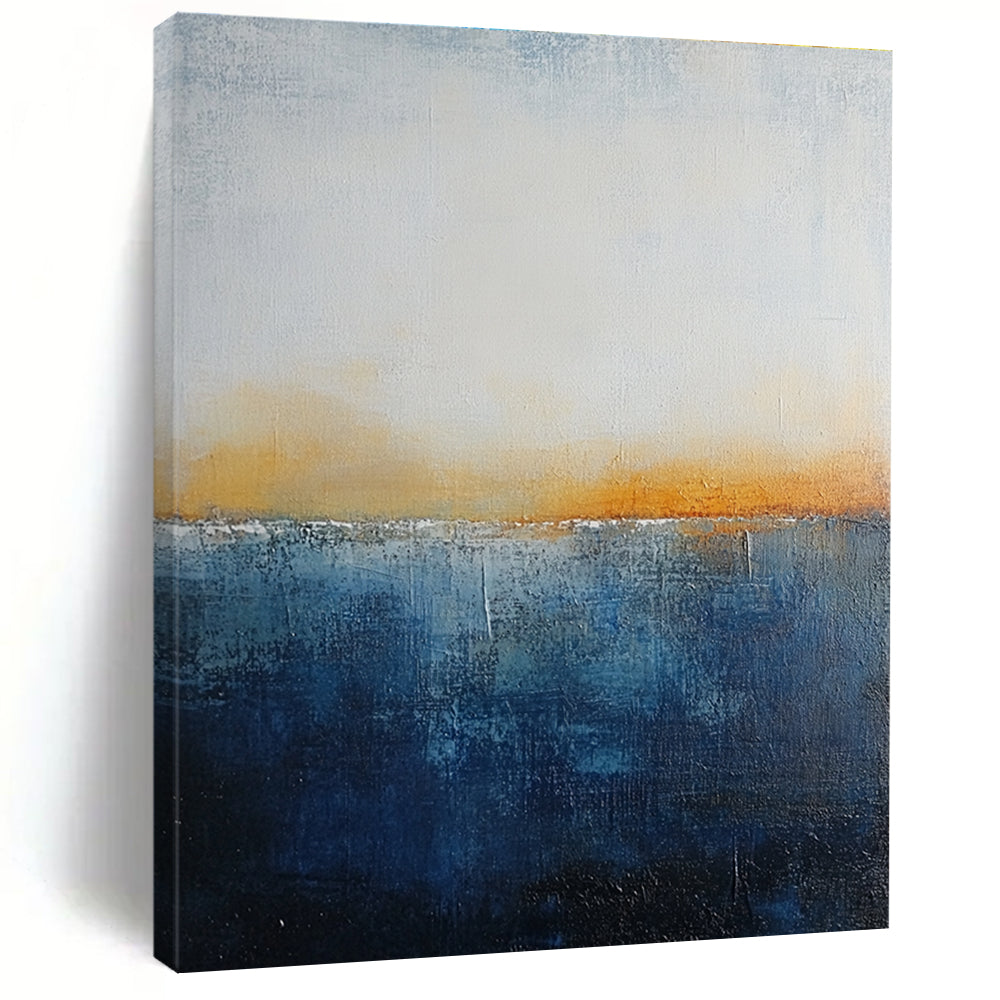 Large abstract painting with layered blue and yellow textures evokes oceanic depths at dusk with soft lighting enhancing movement and depth.STSC109