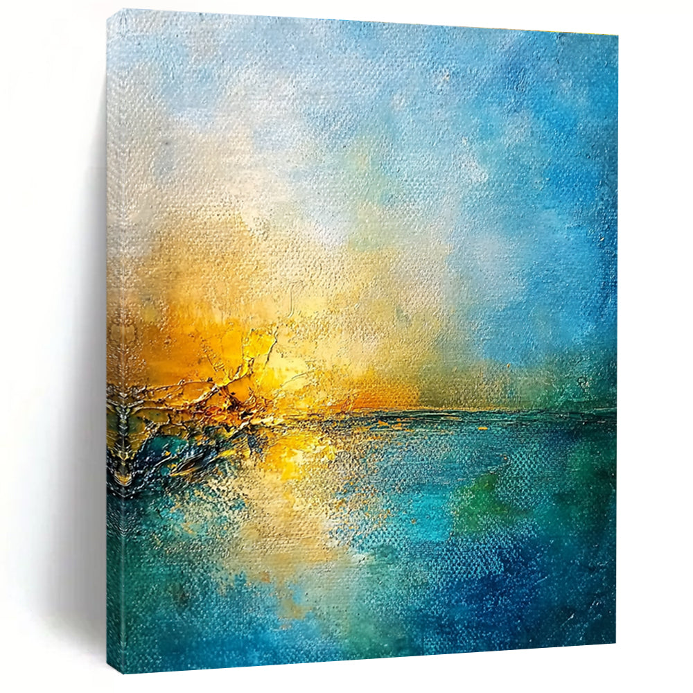 Large abstract painting of a golden sunset over a blue sea featuring textured canvas and rustic-core style nature-inspired colors.STSC165