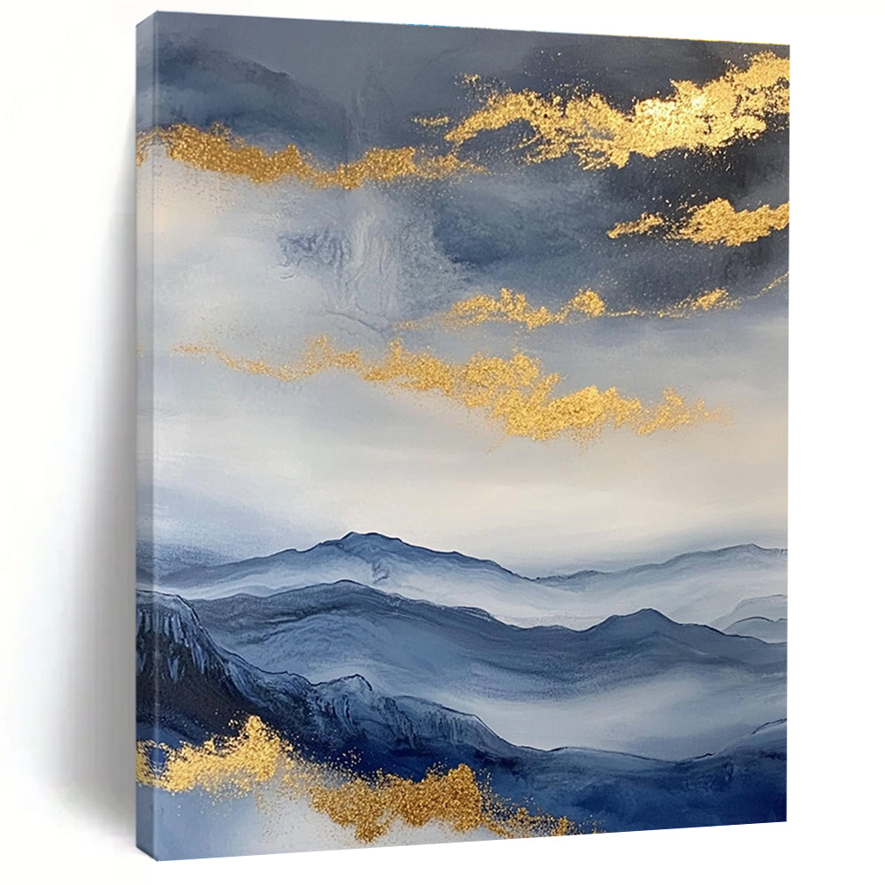 Large abstract painting featuring a beautiful sky mountains and clouds in blue and gray with gold foil accents.STSC279