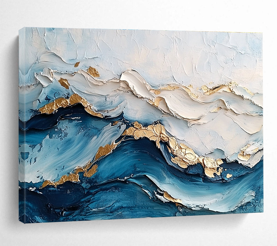 Large abstract painting featuring ocean waves in textured white and blue hues with gold accents for depth and elegance.SC102
