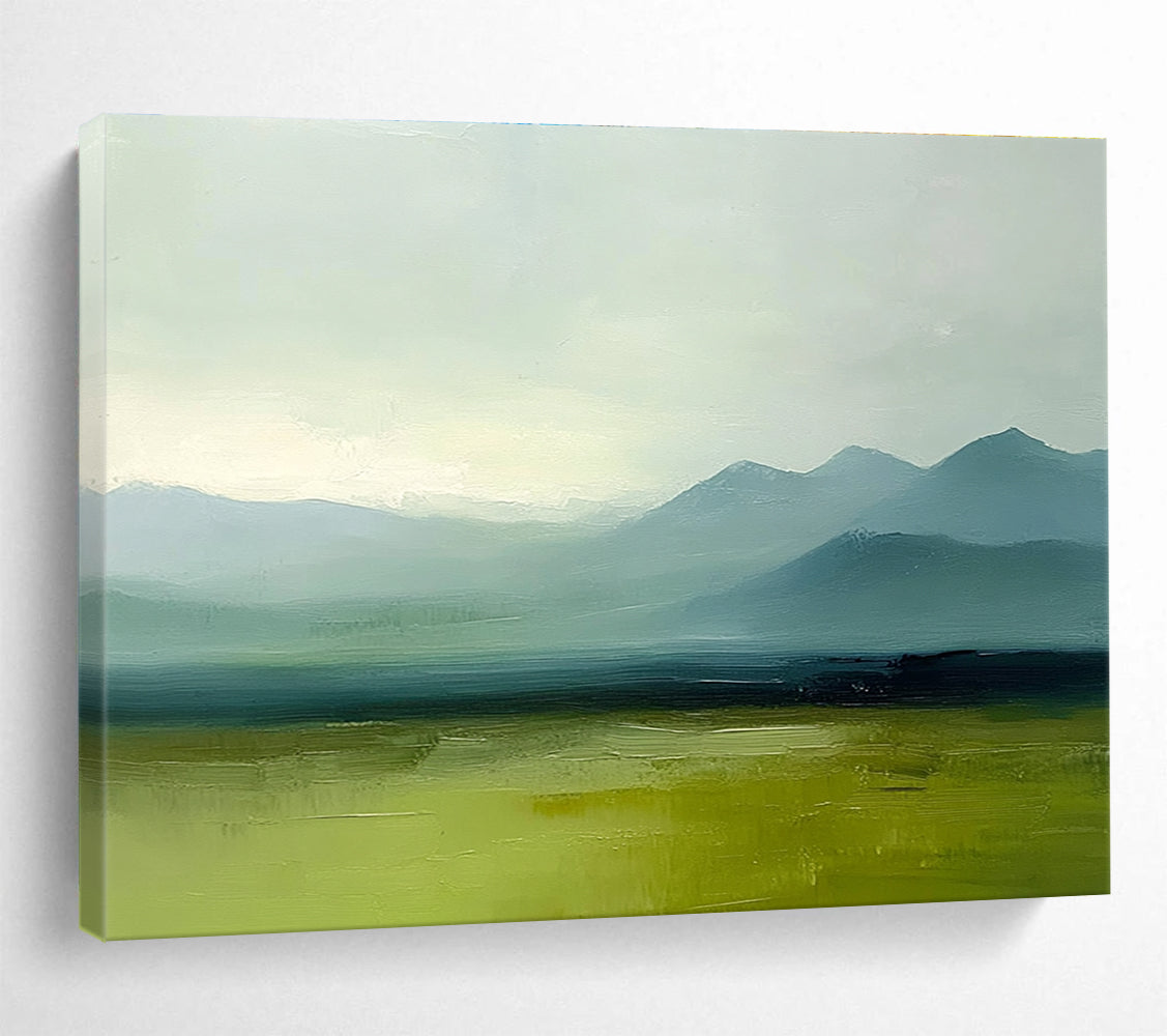 A large abstract oil painting depicting grassy plains and distant mountains in a minimalist style with a green and blue palette under a grey sky.SC409