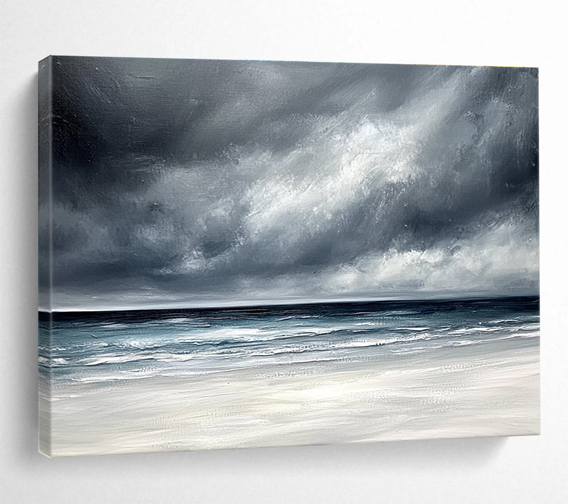 Large abstract painting featuring an ocean with stormy gray clouds and a white sand beach in soft gray and blue tones.SC163