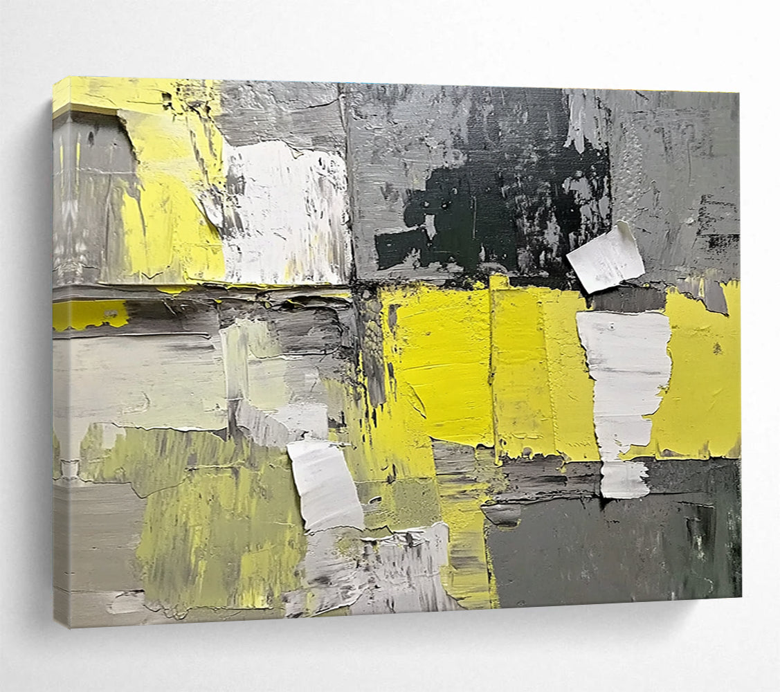 Large abstract painting featuring gray and yellow hues with textured paper elements extending from the wall for added dimension.SC240
