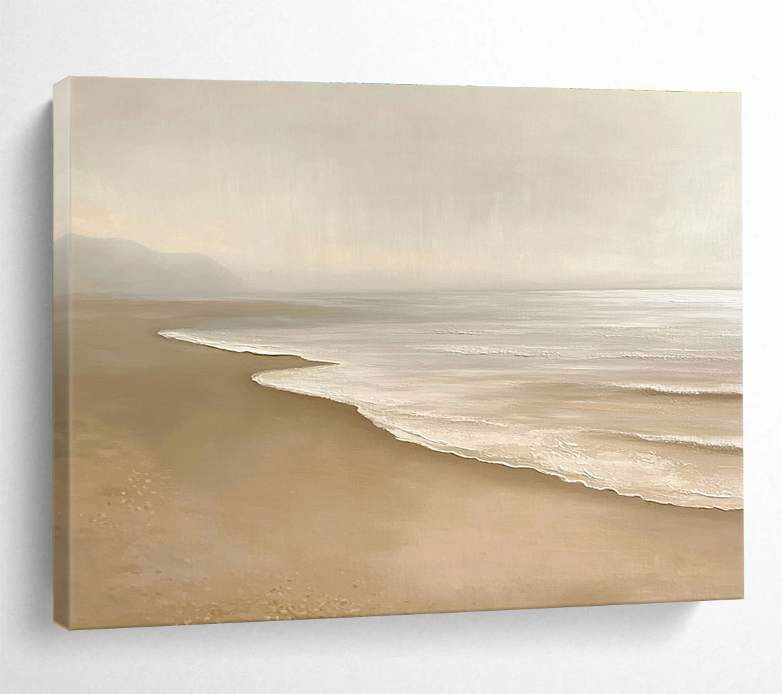 Large abstract painting featuring a serene beach with beige and white tones capturing gentle waves and soft sand in a tranquil setting.SC424