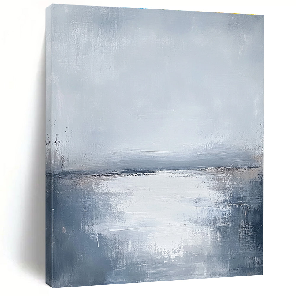 Large abstract painting featuring muted grays and soft blues capturing the serene connection between sunlit water and a cloudy sky.STSC464