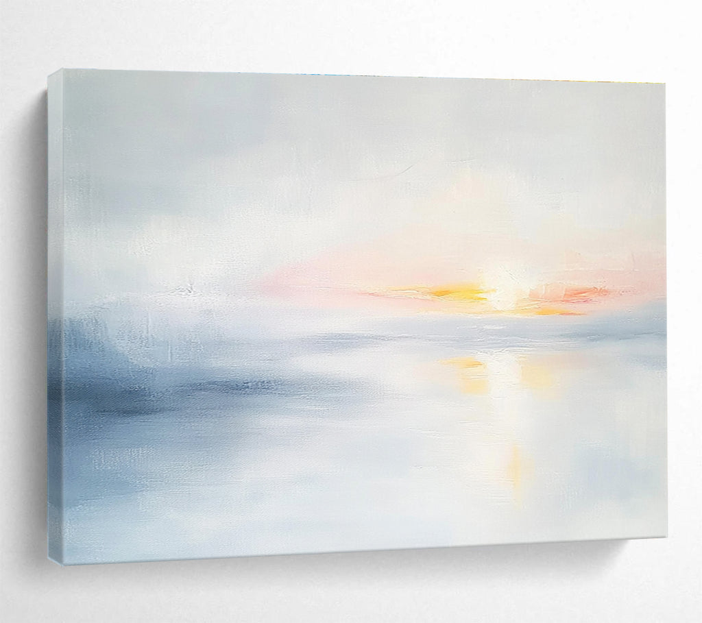 Large abstract painting featuring soft light sky blue and gray tones depicting a serene sunset over calm water on a white background.SC082