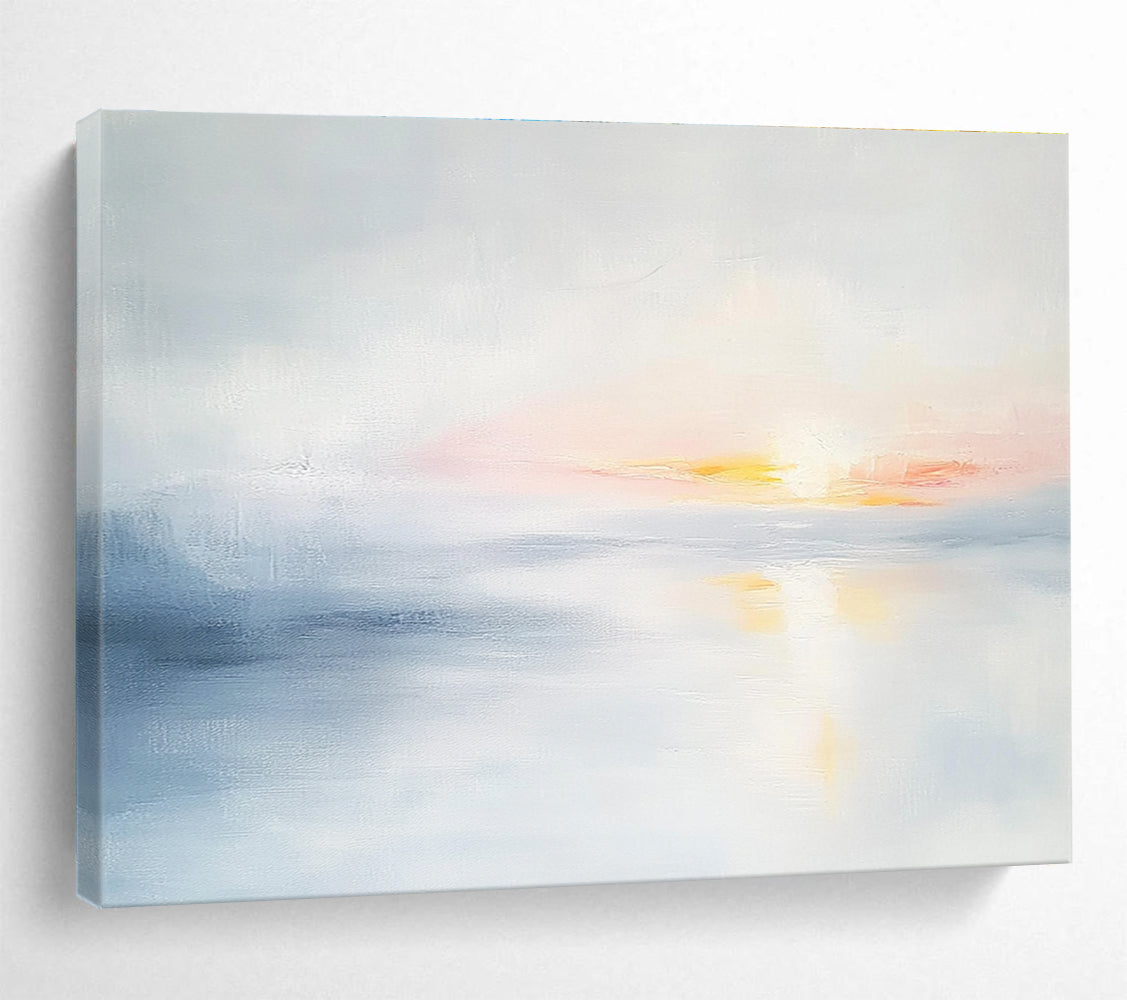 Large abstract painting featuring soft light sky blue and gray tones depicting a serene sunset over calm water on a white background.SC082