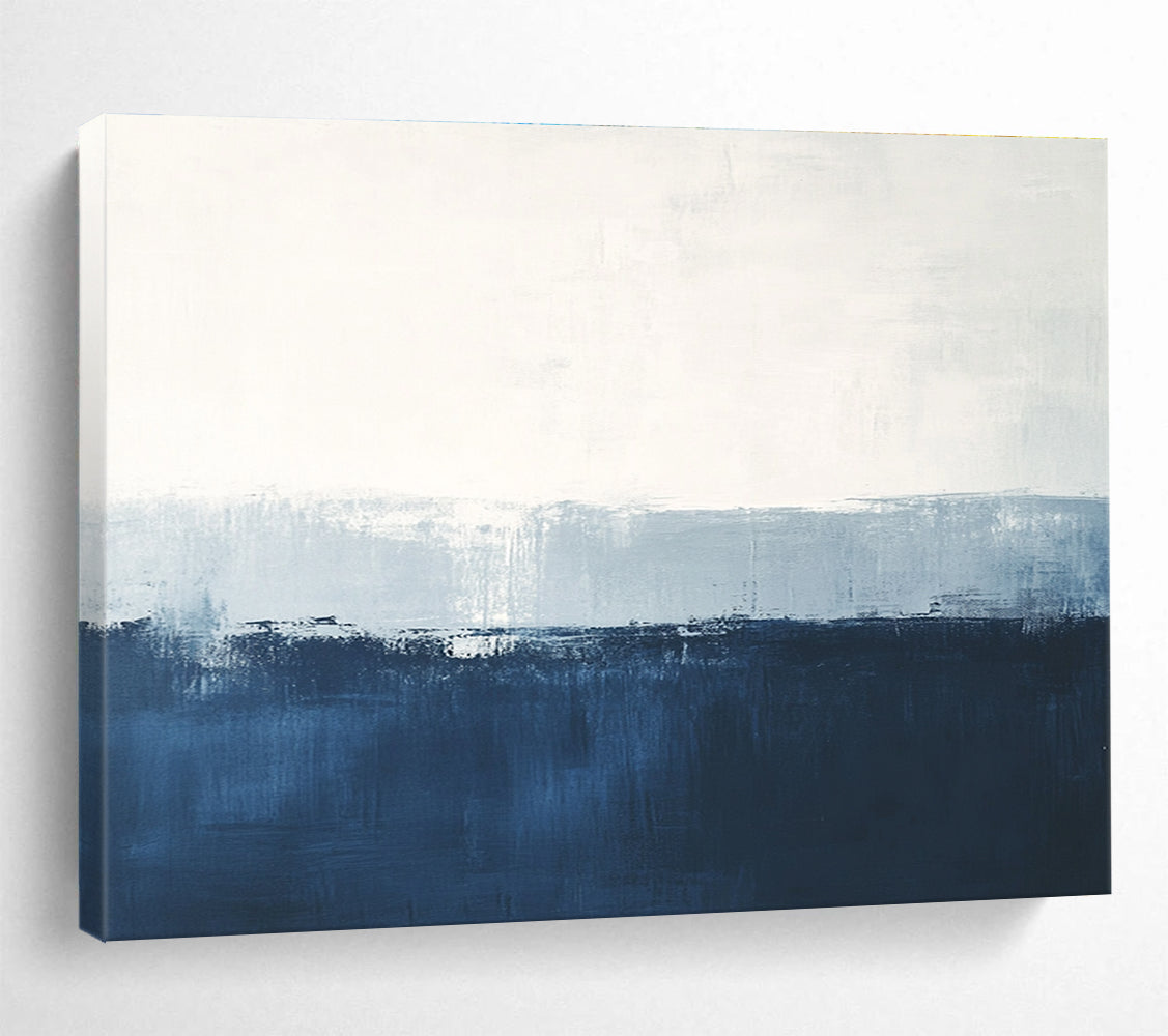 Large abstract painting in calming blue and white with subtle textures tranquil sea view soft edges and atmospheric skies.SC027