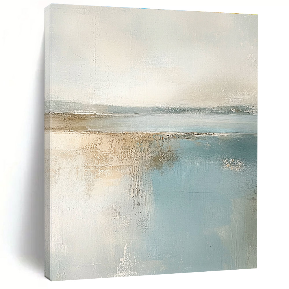 Large abstract painting featuring muted pastel colors of beige and light blue creating a calming beach landscape in neutral tones.STSC017