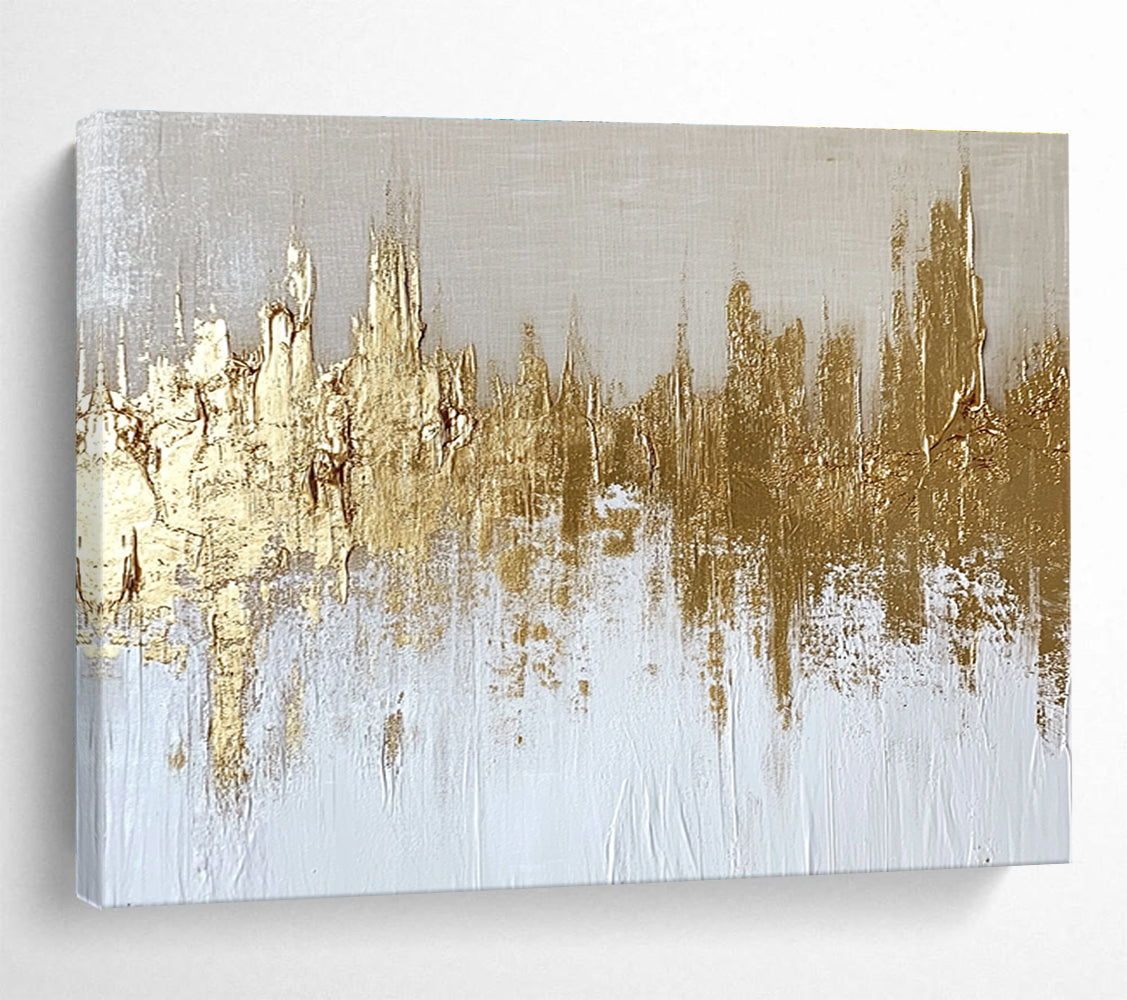 Large abstract painting of a gold and white cityscape with textured canvas and gold foil accents on a neutral background.SC173