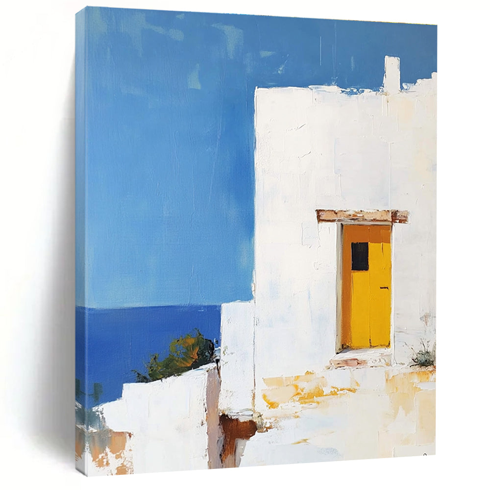 Large abstract painting featuring a white Greek house with a yellow door set against a blue sky in minimalistic style.STSC1252