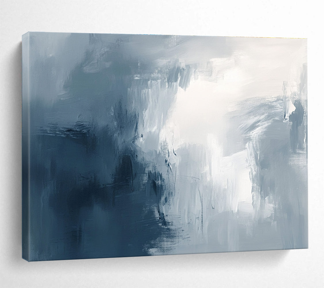 Large abstract painting with broad brush strokes in gray white and navy blue evoking calmness and introspection through soft gradients.SC048