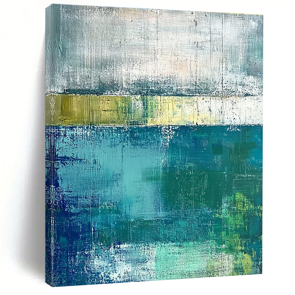 Large abstract painting with green and blue tones on a gray background evokes a serene water's edge mood with textured surfaces.STSC420