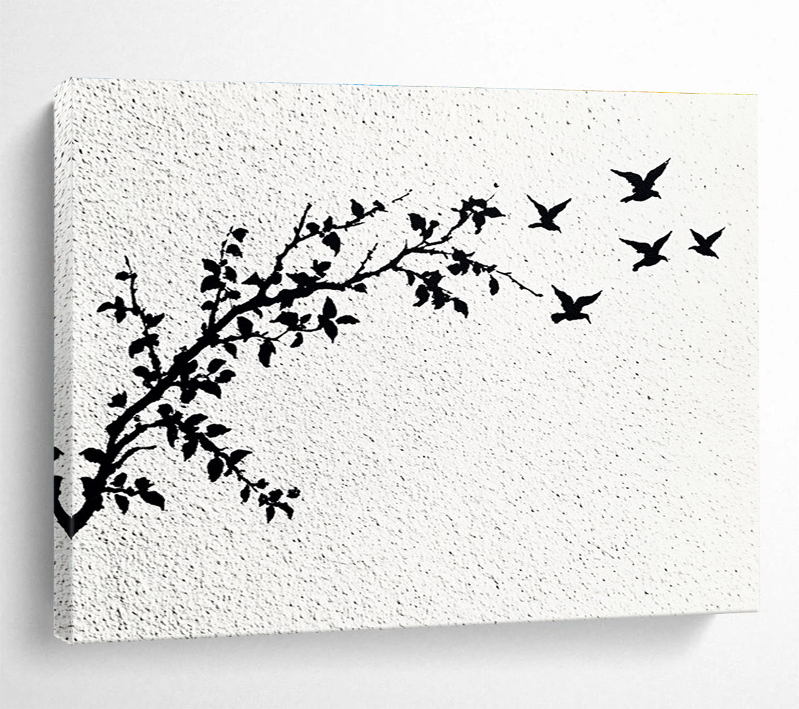 A large abstract painting featuring delicate branches with leaves and black and white flying birds against an off-white wall.SC434