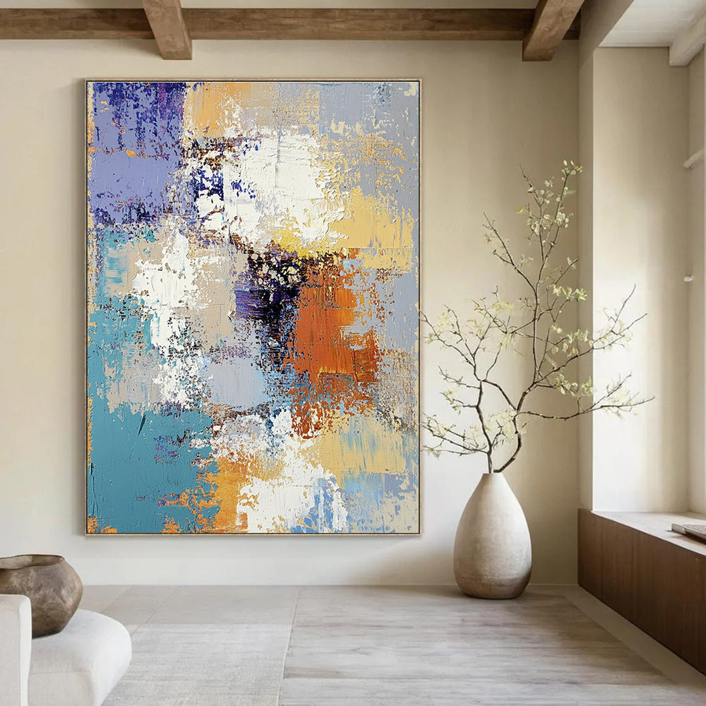 Large abstract oil painting featuring textured layers of blue yellow white gray beige and brown with intricate patterns and emotional depth.STSC584