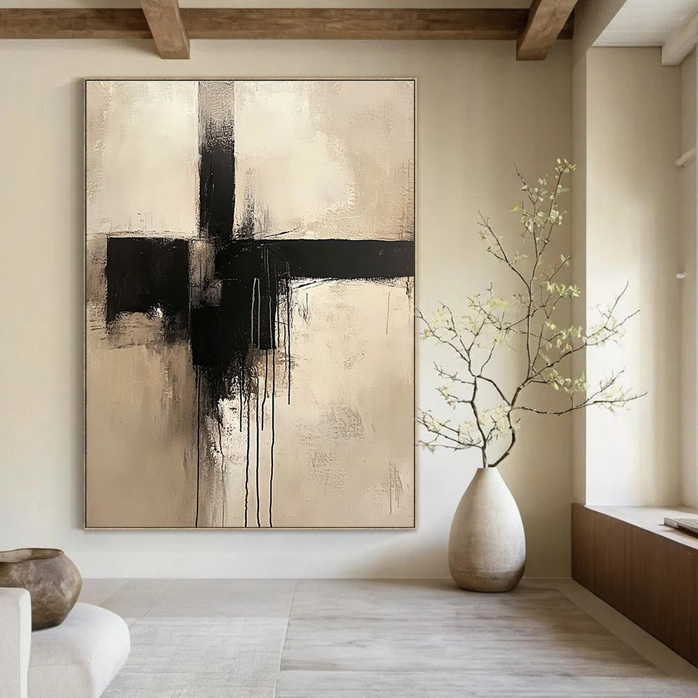Large abstract painting of a cross in neutral colors featuring a minimalist style and dripping black paint.STSC669