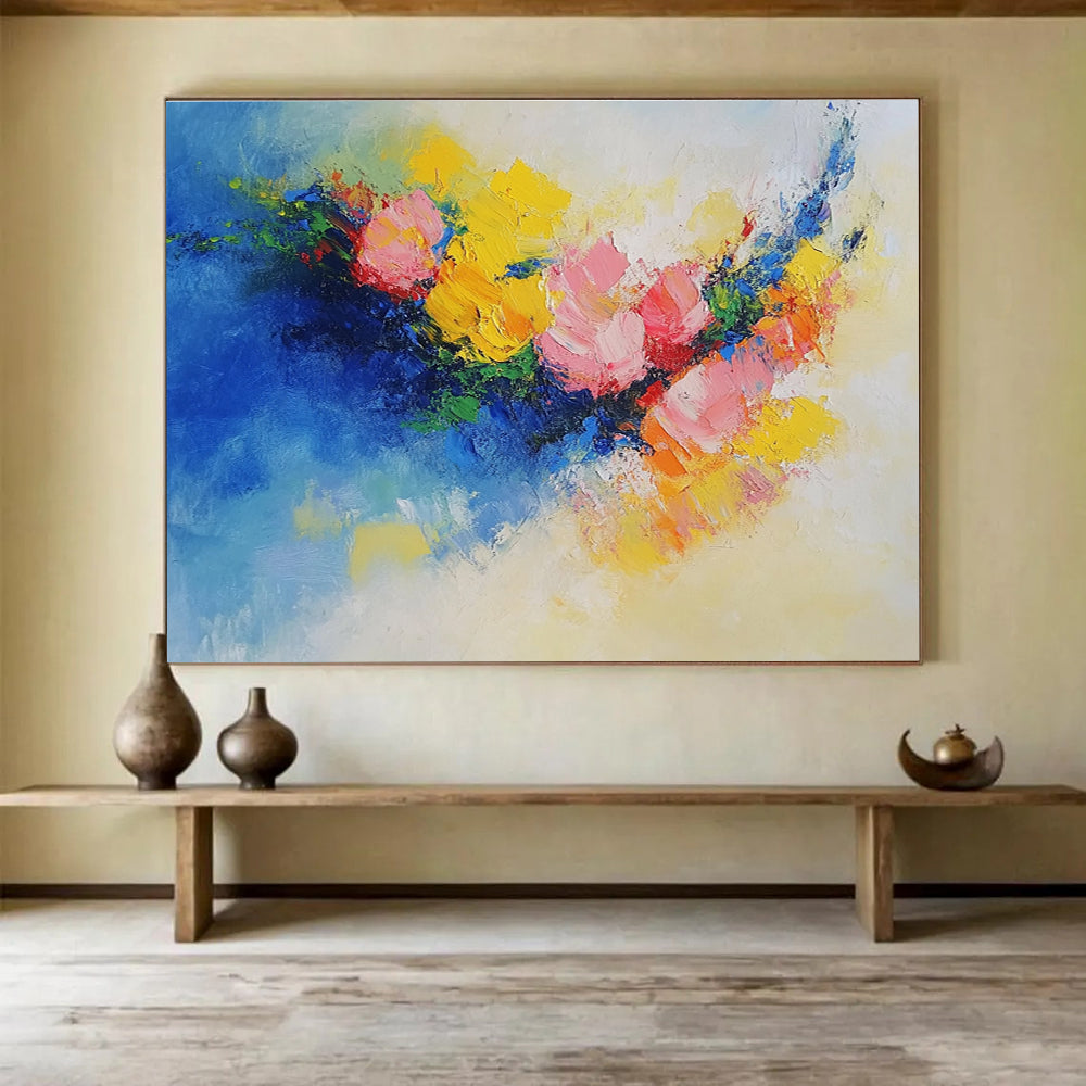 Large abstract painting of flowers in vibrant yellow, blue, and pink featuring textured palette knife techniques. Perfect for modern decor.SC190