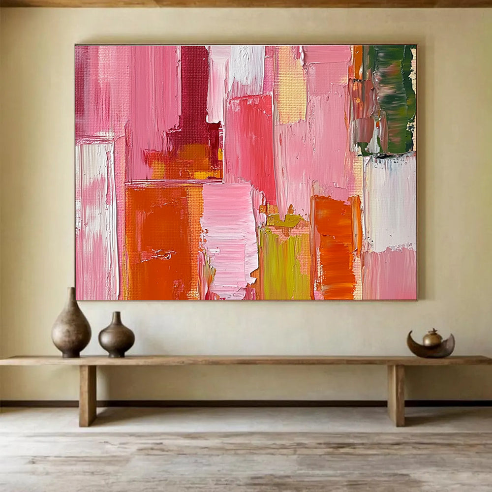 Large abstract oil painting featuring a pink orange and red cityscape with thick brush strokes and a soft impressionist style.SC118