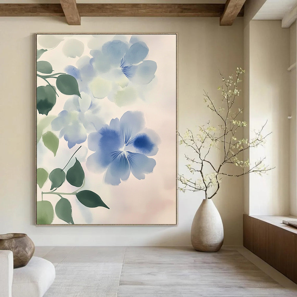 Large abstract watercolor painting of light blue and white flowers with green leaves against a soft gray gradient emphasizing fluidity and movement.STSC1050