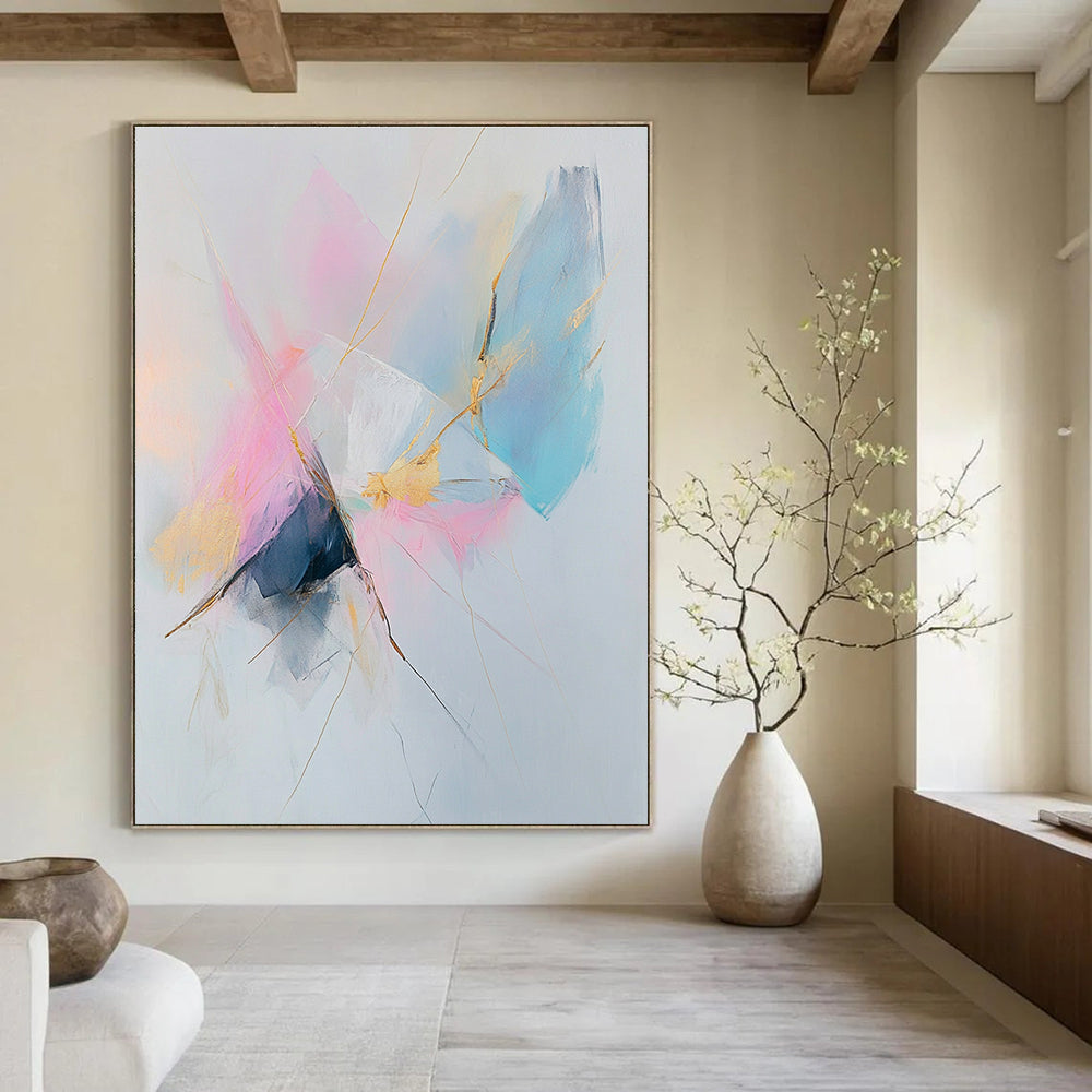 Large abstract painting featuring pastel pink and blue tones with gold accents on a white background creating a serene and calming atmosphere.STSC783
