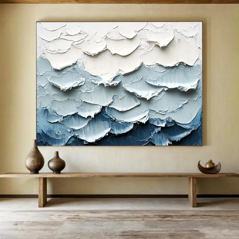 Large abstract painting of waves featuring a white and blue color palette with thick impasto texture for a striking visual effect.SC205
