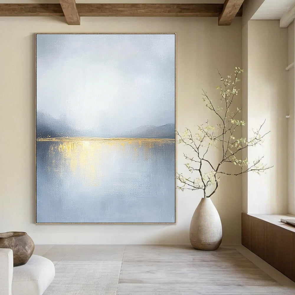 Large abstract painting of an overcast sky with golden water reflections soft tones and serene landscape capturing a tranquil mood.STSC271