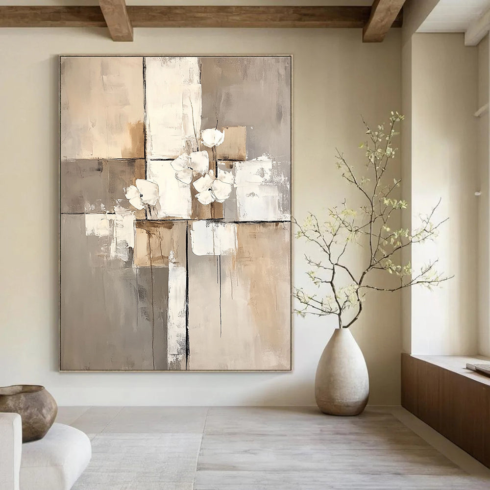 Large abstract painting featuring white paint blocks with a beige and gray palette on a neutral beige background.STSC431