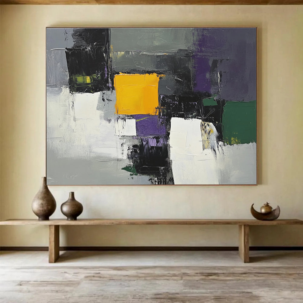 This large abstract painting features gray white and purple shapes with a central yellow square and green and olive accents using thick brush strokes.SC324