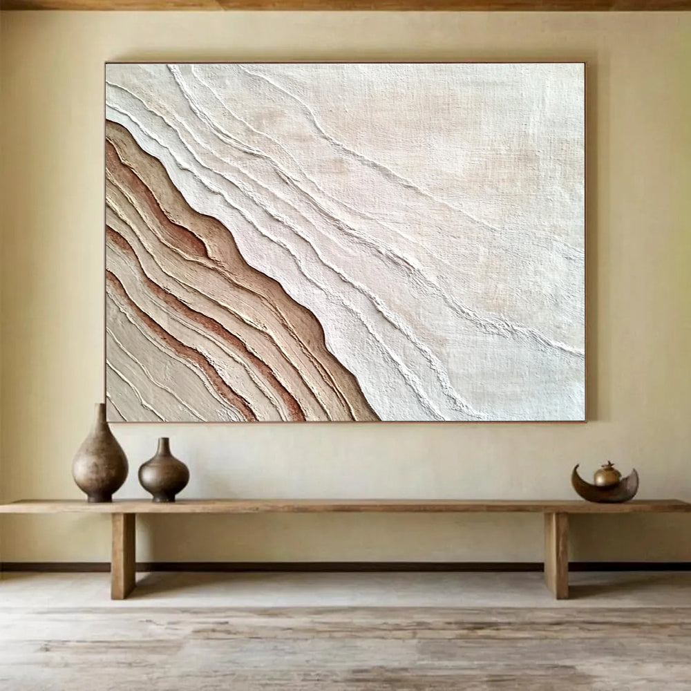 An abstract painting featuring the interplay of sand and water in white and brown hues, symbolizing growth and change through rich textures.SC448