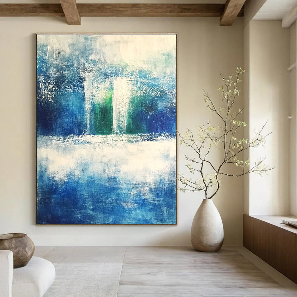Large abstract painting evoking serene nature with shades of blue green gray and white featuring dynamic brushstrokes of rolling hills and waves.STSC368