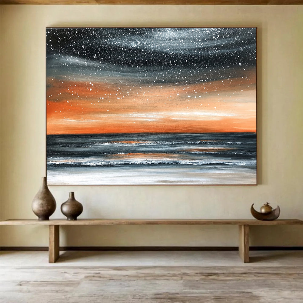 Large abstract painting of the ocean at night featuring an orange gray sky and starry snowfall over a muted water surface.SC130