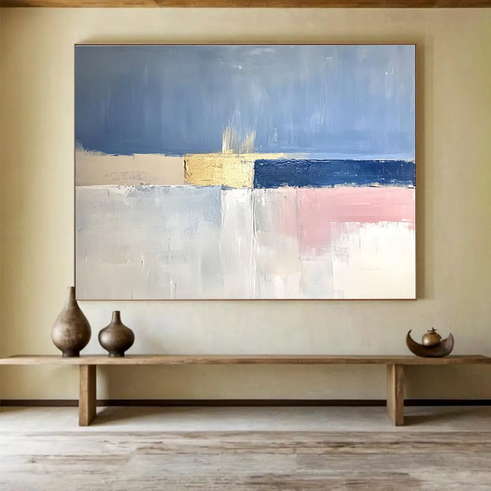 Large abstract painting featuring soft blue skies, pale pink horizons, gold highlights, and a tranquil sea in muted tones.SC025