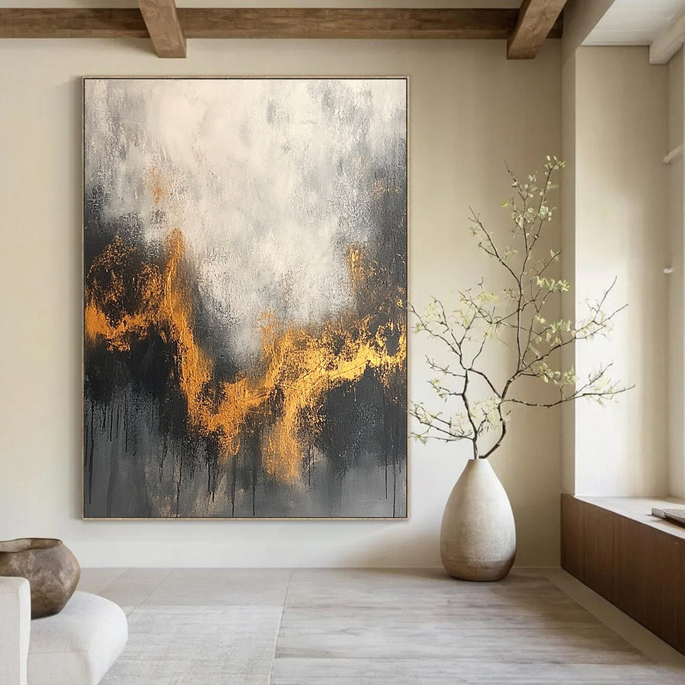 Large abstract painting with a gray and white background accentuated by gold tones and dark colors for an atmospheric effect.STSC394