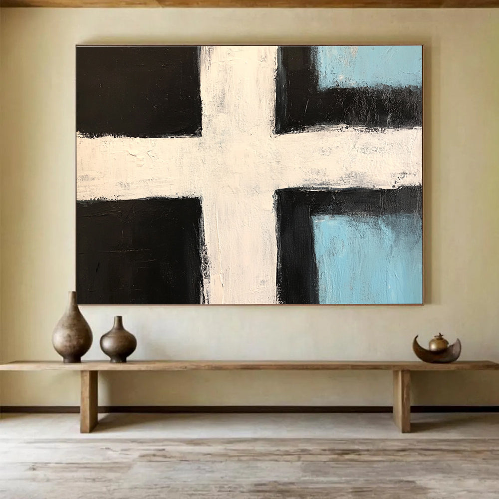 Abstract painting featuring a bold black and white cross with light blue accents and thick brush strokes in a minimalistic style.SC168