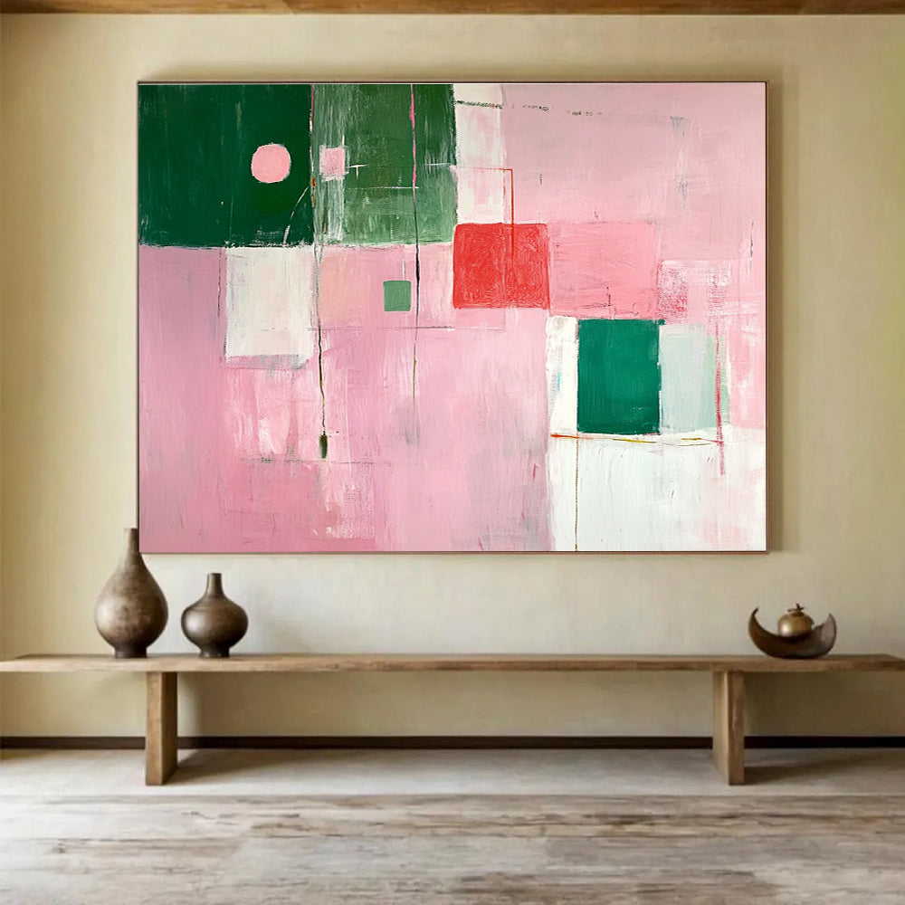 A large abstract painting featuring soft pink and green shapes creates a calming atmosphere with an inviting glow and an empty center.SC538
