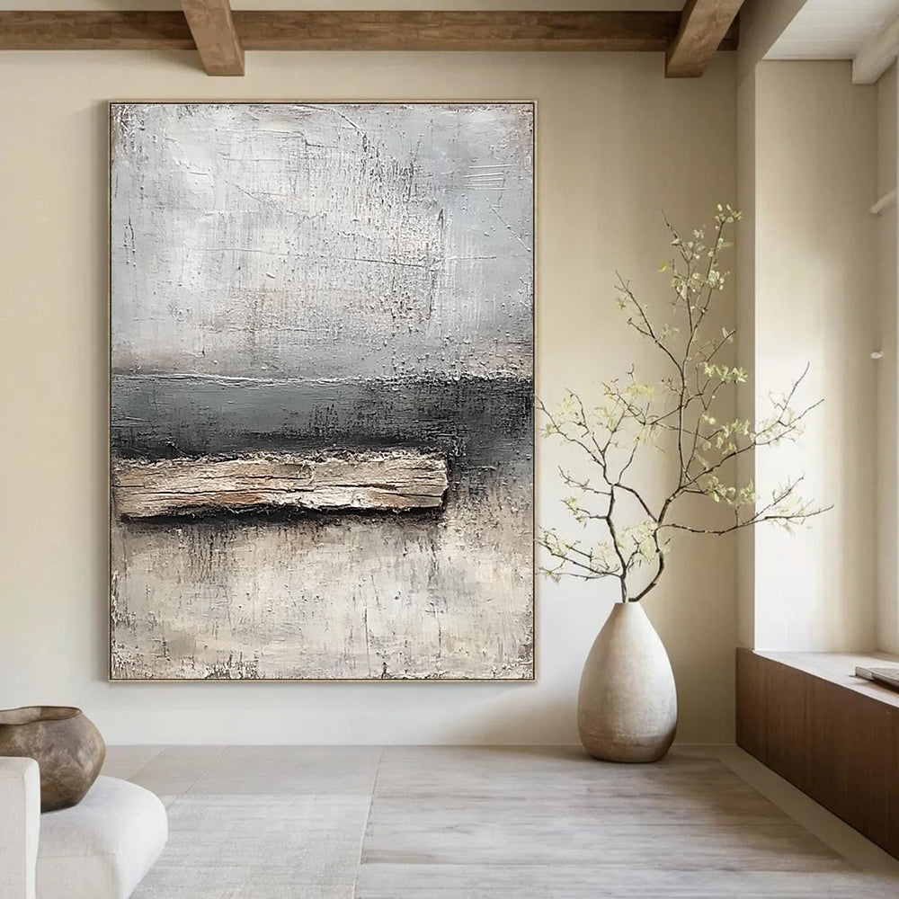 Abstract painting featuring neutral tones of gray and white with textured canvas and thick paint highlighting a small piece of old wood by the water's edge.STSC138