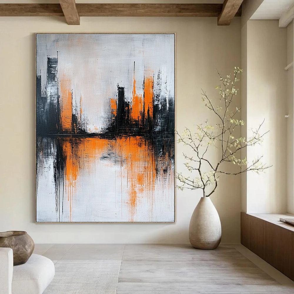 Large abstract painting featuring gray and white background with orange brushstrokes and urban landscape silhouette reflecting on water surface.STSC225