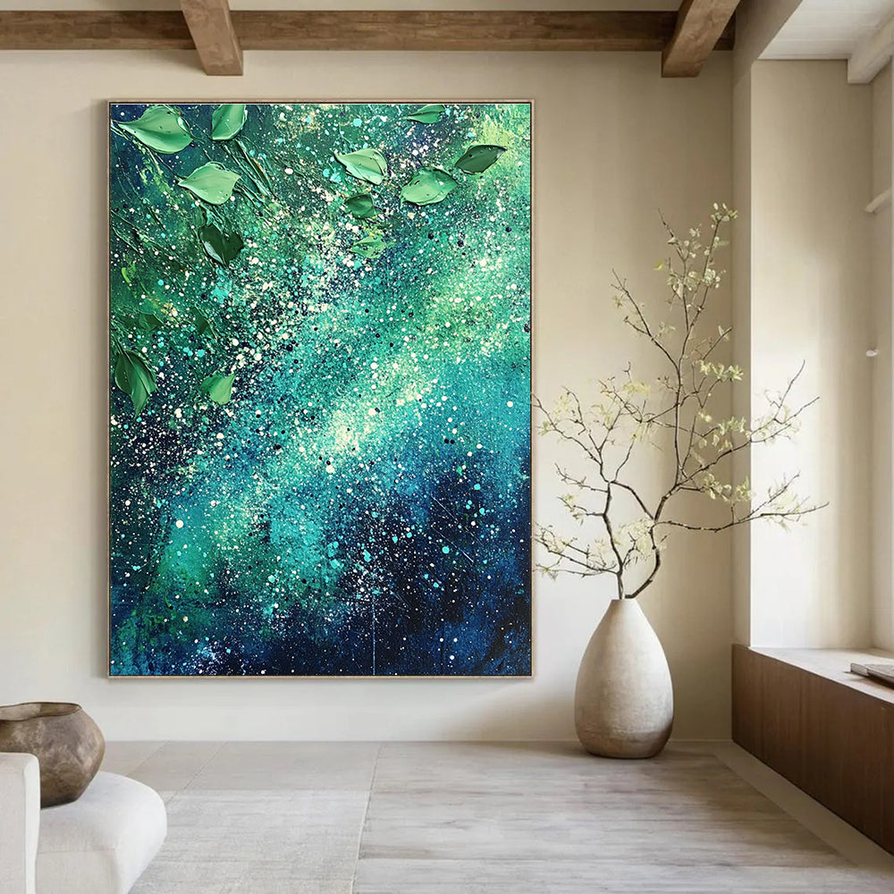 Large abstract painting of the Milky Way featuring vibrant green and blue hues with white speckles and scattered leaves for texture and cosmic beauty.STSC065