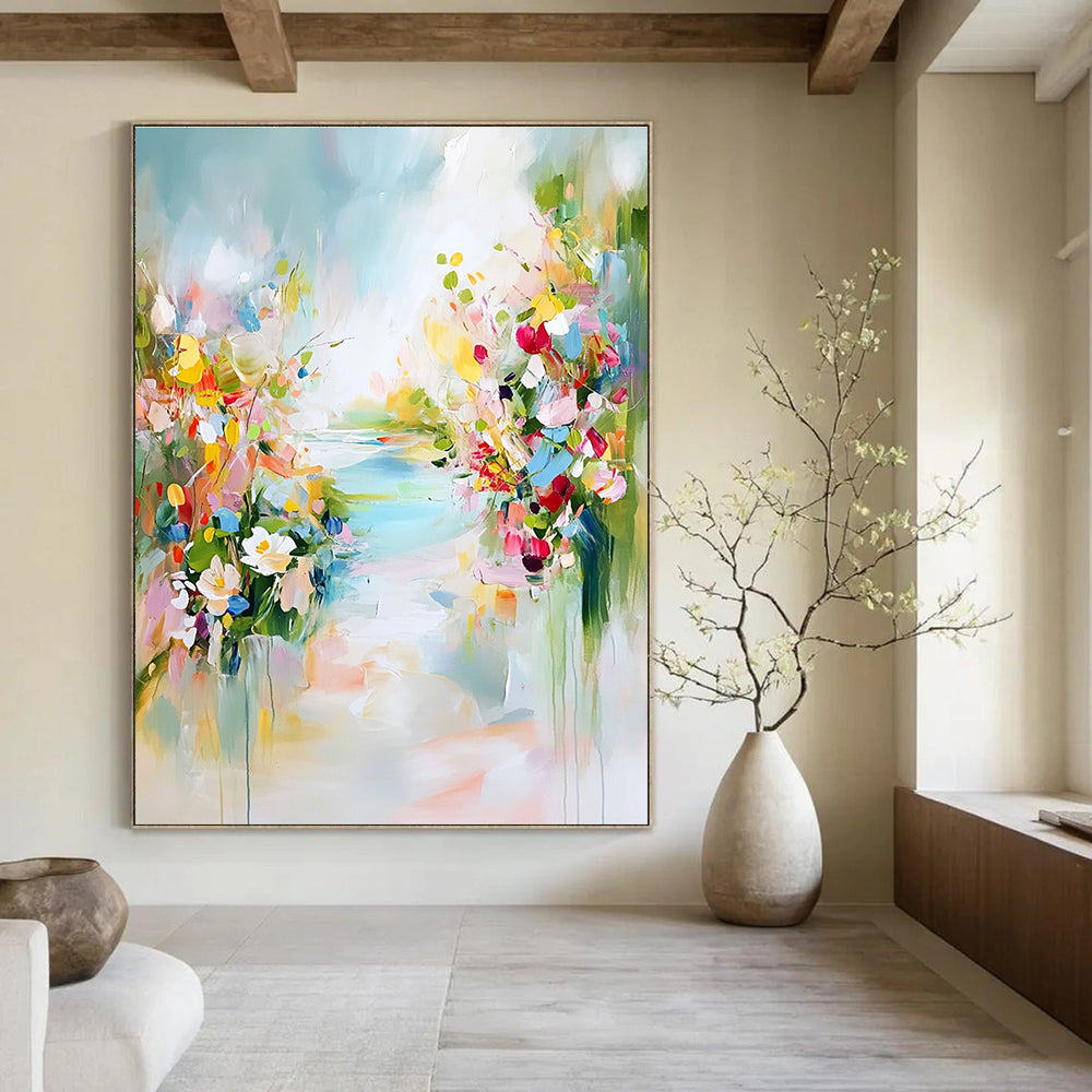 A large abstract painting depicting a tranquil spring landscape with colorful flowers soft skies and hints of blue water.STSC891