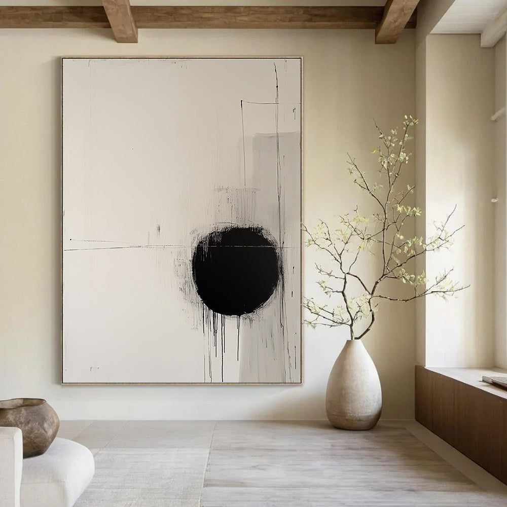 Large abstract painting featuring a round black circle on off-white canvas surrounded by delicate lines evoking movement and tranquility.STSC1067