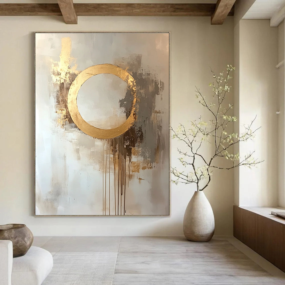 Large abstract oil painting featuring a moon with a golden circle in beige and gold tones with dripping gold leaf on a white background.STSC170