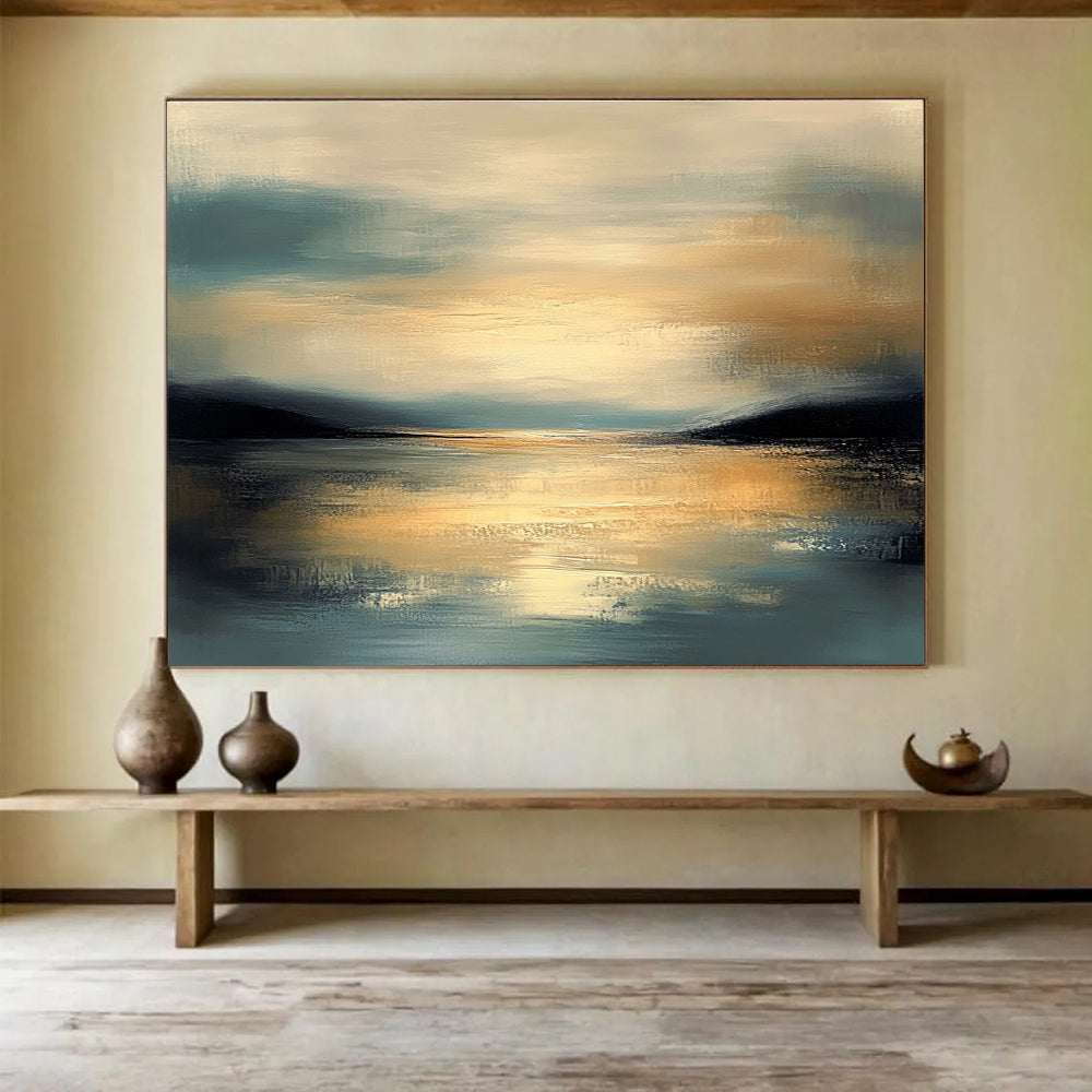Large abstract painting featuring muted colors and calm water reflecting a detailed sky during golden hour with a serene atmosphere and gentle brushwork.SC064