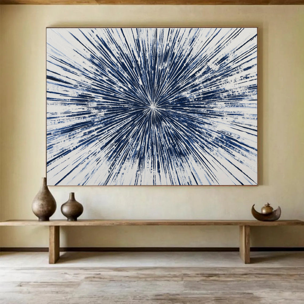 Large abstract painting featuring a blue starburst design with intricate radiating lines, creating a vibrant and energetic composition on a white background.SC430
